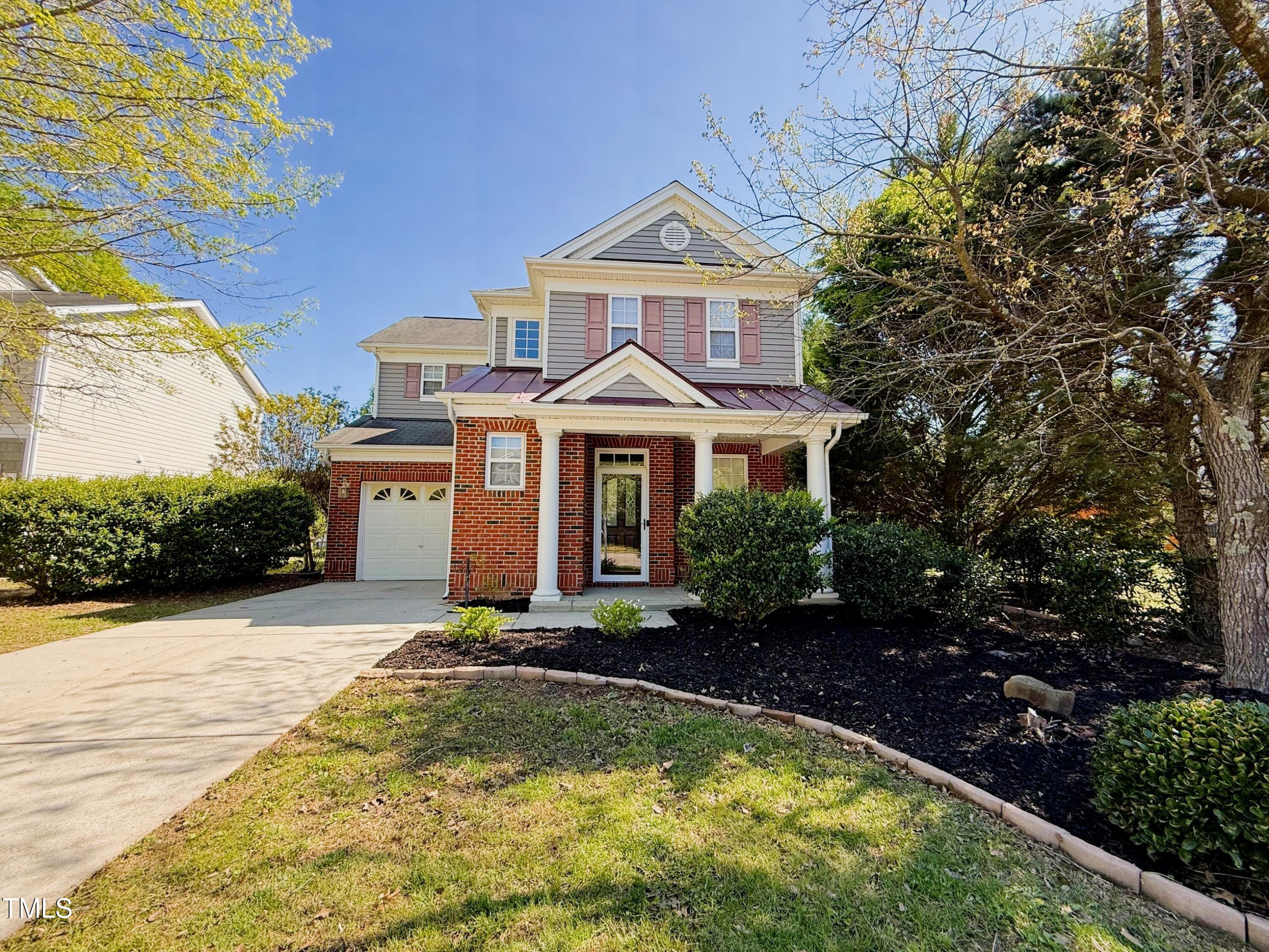 1104 Pebblestone Drive Durham, NC 27703 - Photo 2 of 28 a front view of a house with a yard