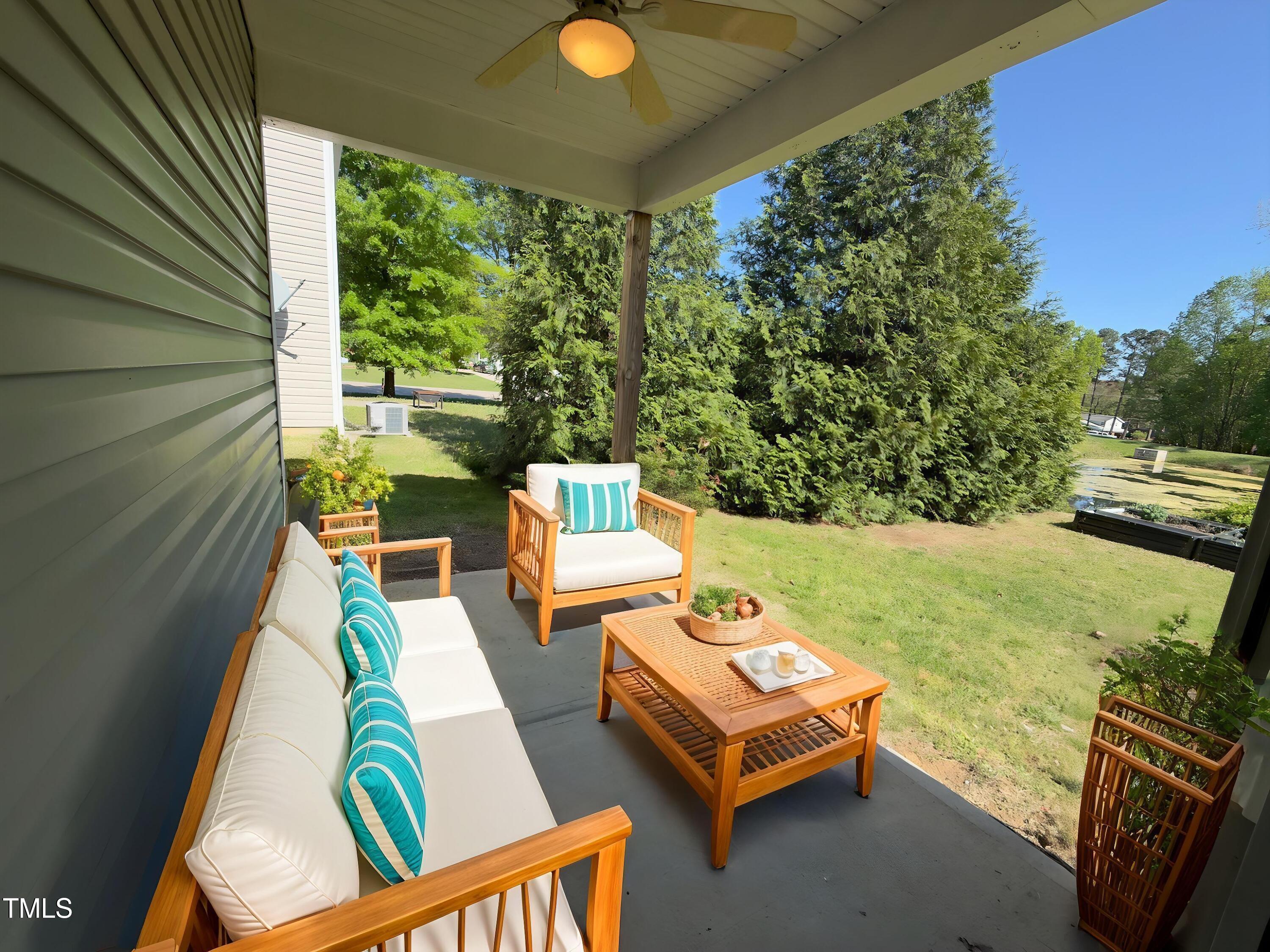 1104 Pebblestone Drive Durham, NC 27703 - Photo 26 of 28 a backyard of a house with outdoor seating