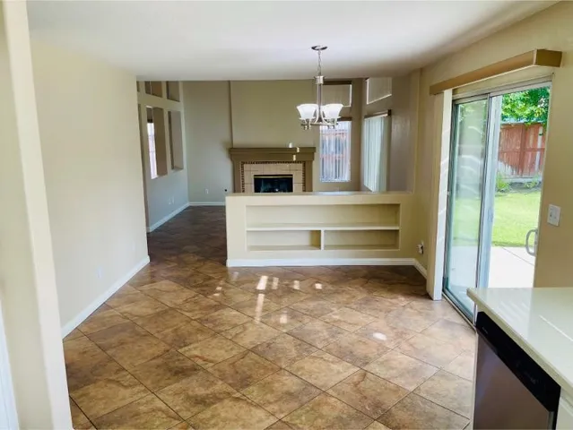 a kitchen with a sink cabinets and appliances