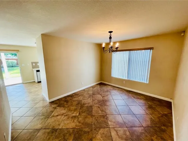 an empty room with a empty space and a window