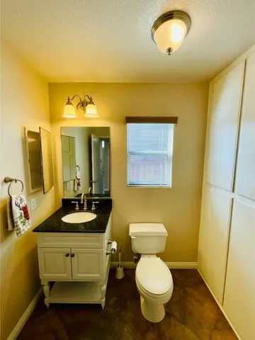 a view of a hallway with wooden floor and stairs