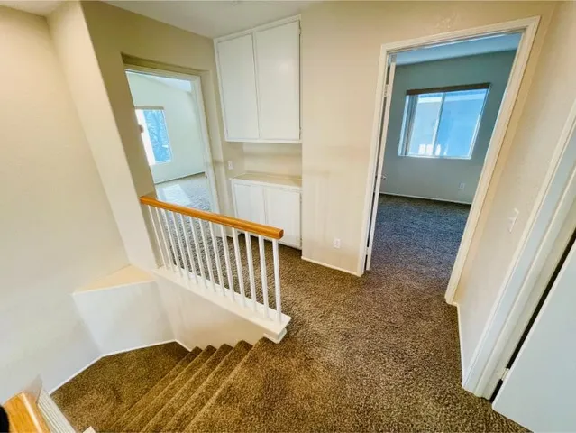 a bathroom with a granite countertop toilet a sink and bathtub
