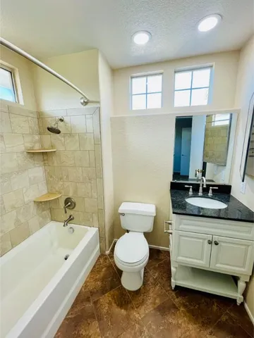 a bathroom with a double vanity sink mirror and shower