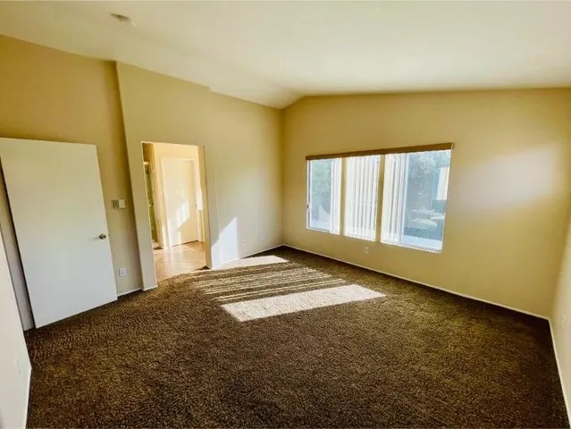 a view of a house with swimming pool and a yard