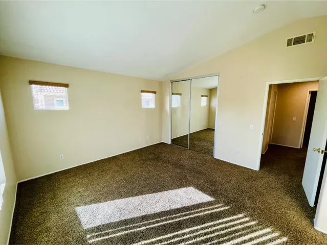 a view of a white house with yard