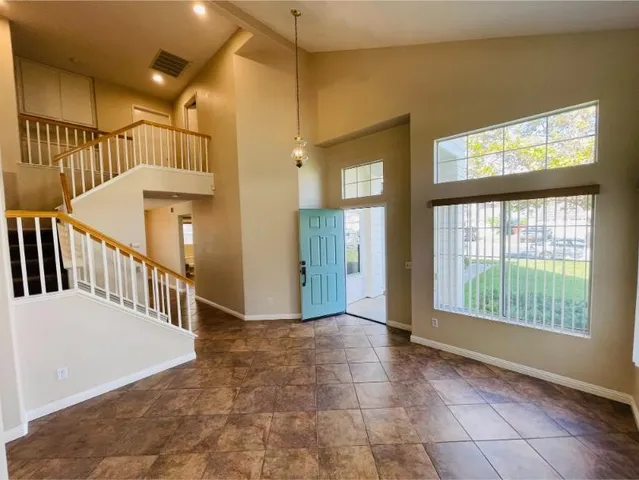 a view of empty room with a fireplace