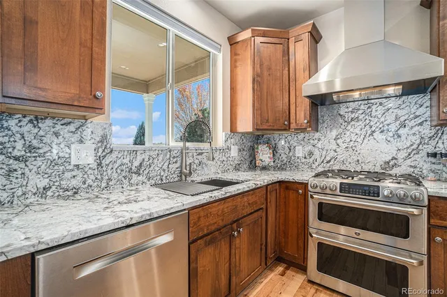 a kitchen with a sink stove and cabinets