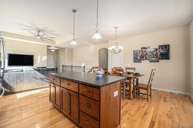 a kitchen with a table and chairs in it