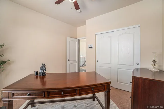 a room with a table chairs and wooden floor