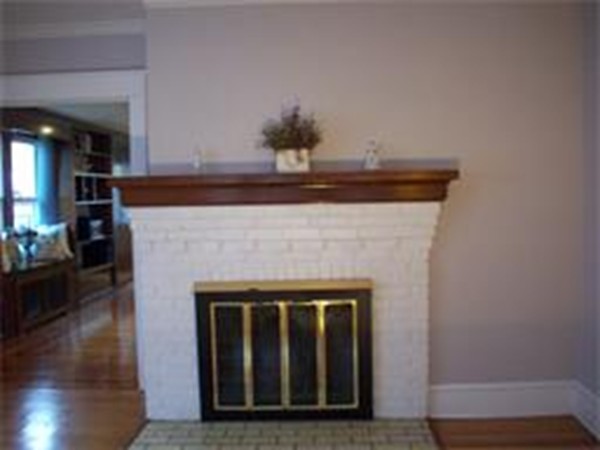 101 Sylvan Street Springfield, MA 01108 - Photo 7 of 29 a living room with furniture and a fireplace