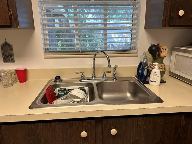 a bedroom with furniture and a flat screen tv