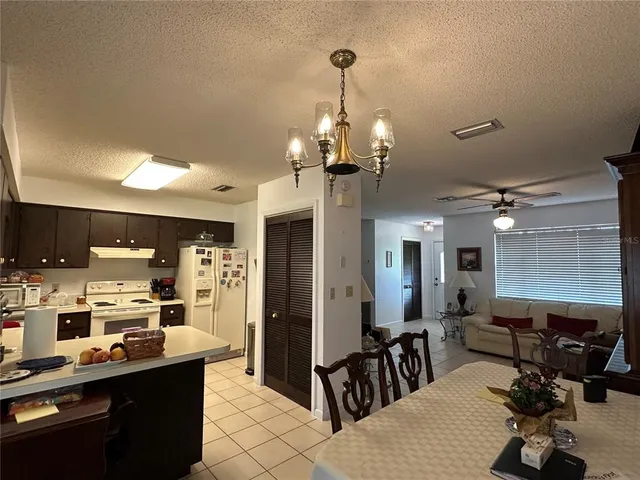 a table and chairs sitting in the middle of a house