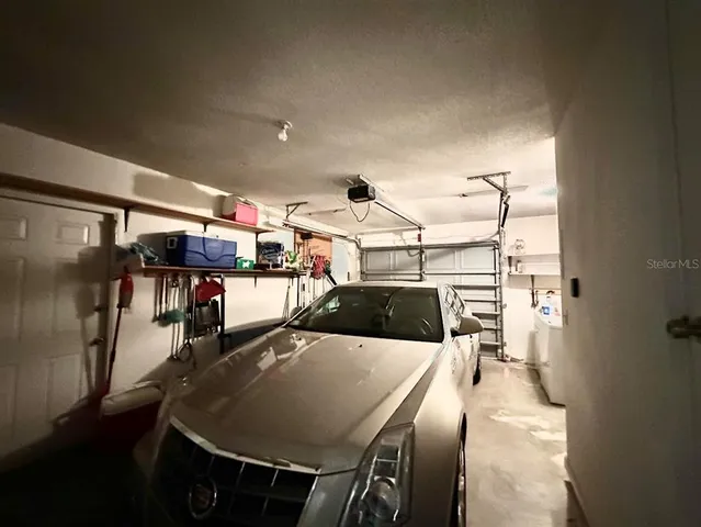 a view of a dining room with furniture and a window