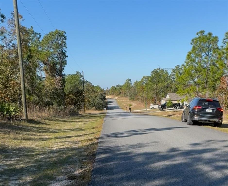 6783 North Pavilion Loop Citrus Springs, FL 34433 - Photo 3 of 10 a view of a car parked on the side of a road