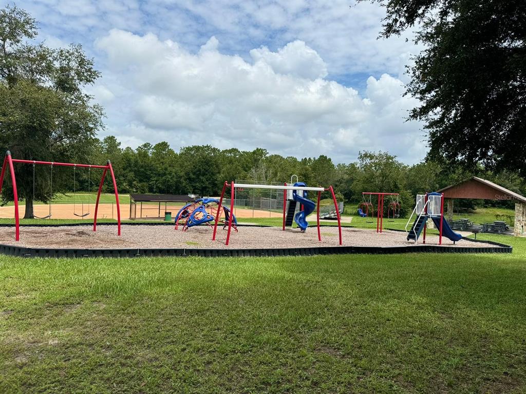 6783 North Pavilion Loop Citrus Springs, FL 34433 - Photo 5 of 10 a view of a park with large trees