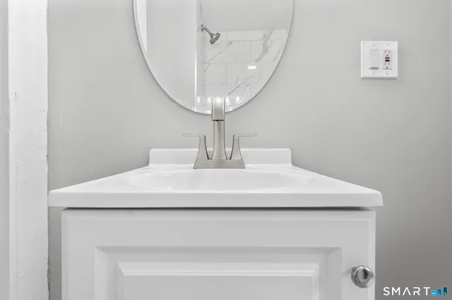 a view of a big room with wooden floor and windows