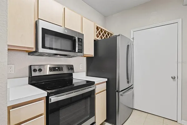 a kitchen with a stove microwave and refrigerator