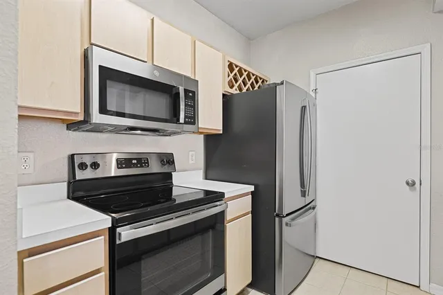 a kitchen with a stove microwave and refrigerator