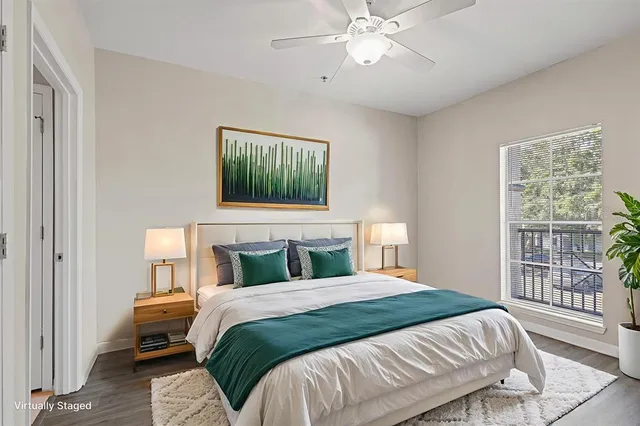 a bedroom with a bed and a window