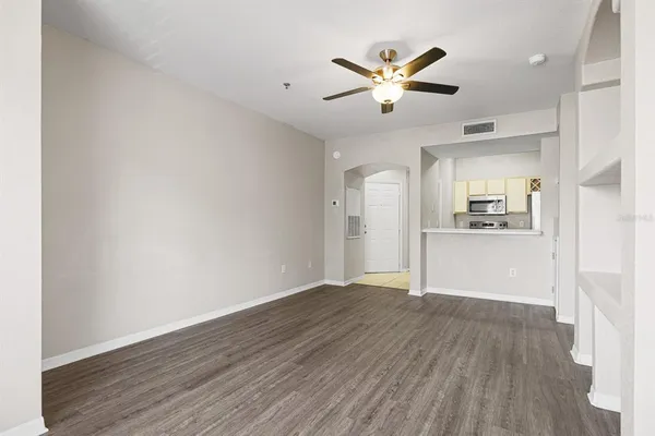 a view of a kitchen with wooden floor and a kitchen