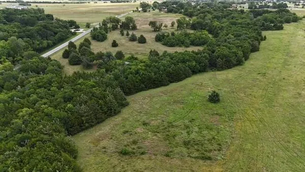 a view of a lake with a yard