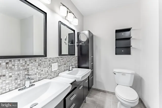 a view of an empty room with a fireplace