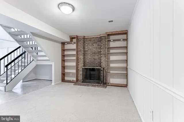 a kitchen with granite countertop a stove top oven sink and cabinets
