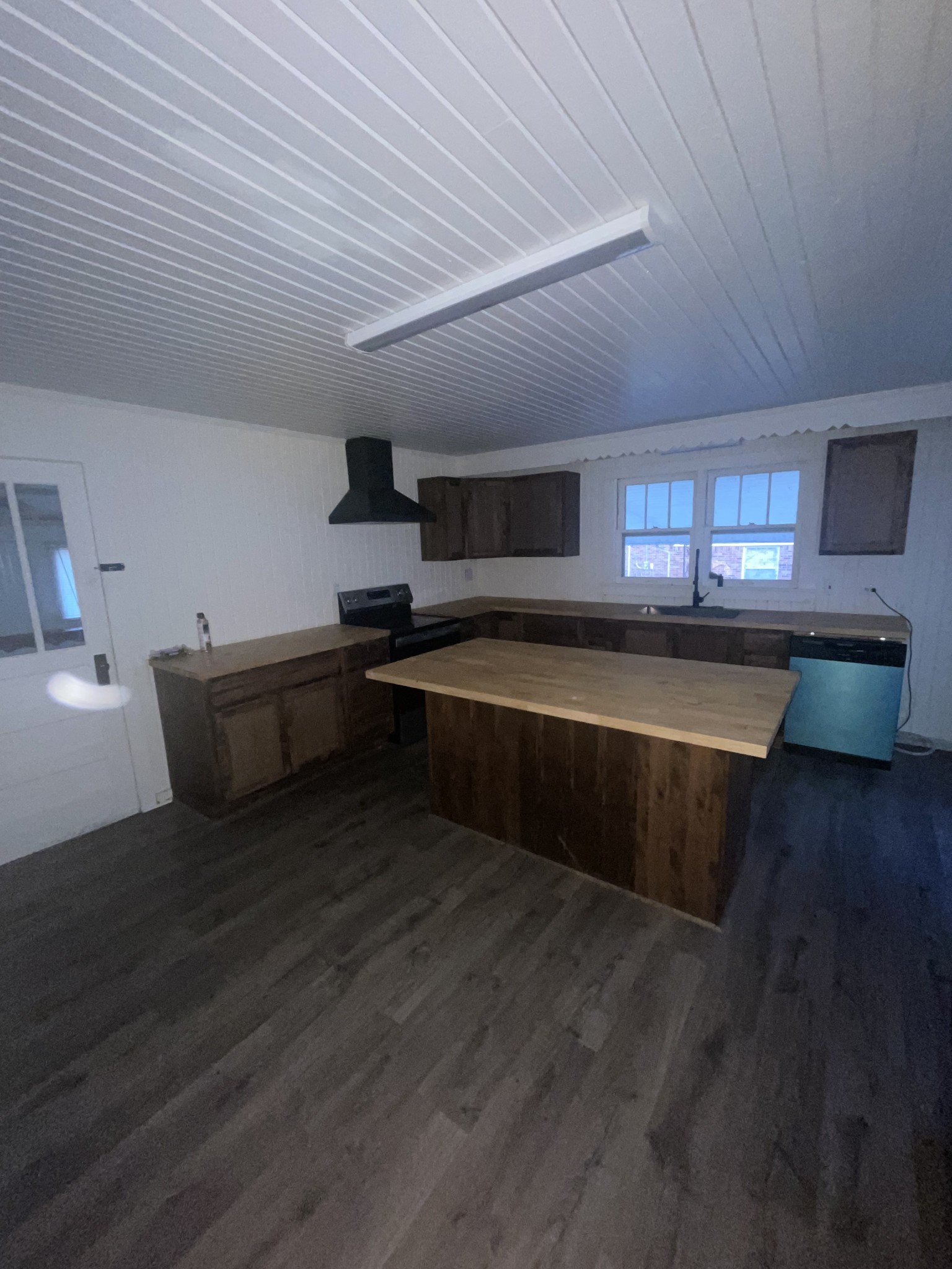 512 McKnight Street Rutherford, TN 38369 - Photo 2 of 17 a kitchen with stainless steel appliances wooden cabinets granite counter tops and a wooden floor