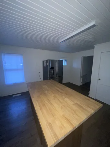an empty room with wooden floor
