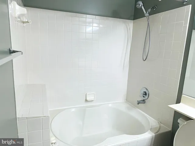a bathroom with a white tub