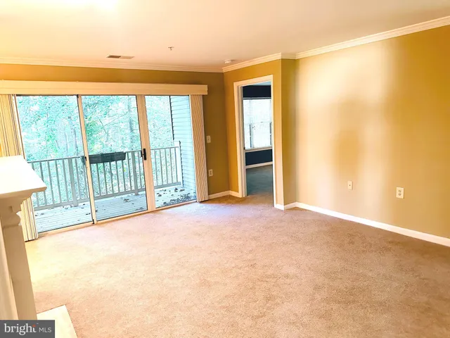 a view of a room with a large window