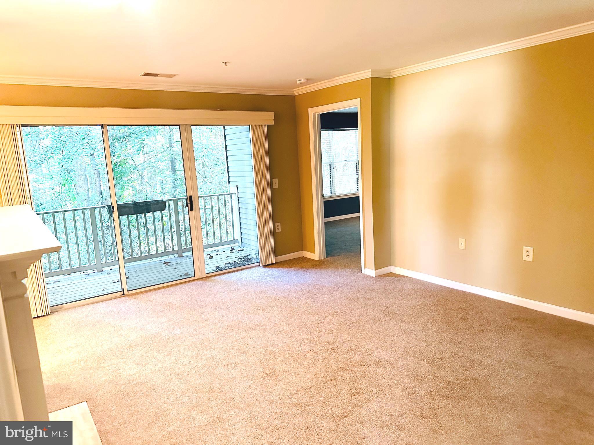 115 Timberbrook Lane, Unit 102 Gaithersburg, MD 20878 - Photo 4 of 20 a view of a room with a large window