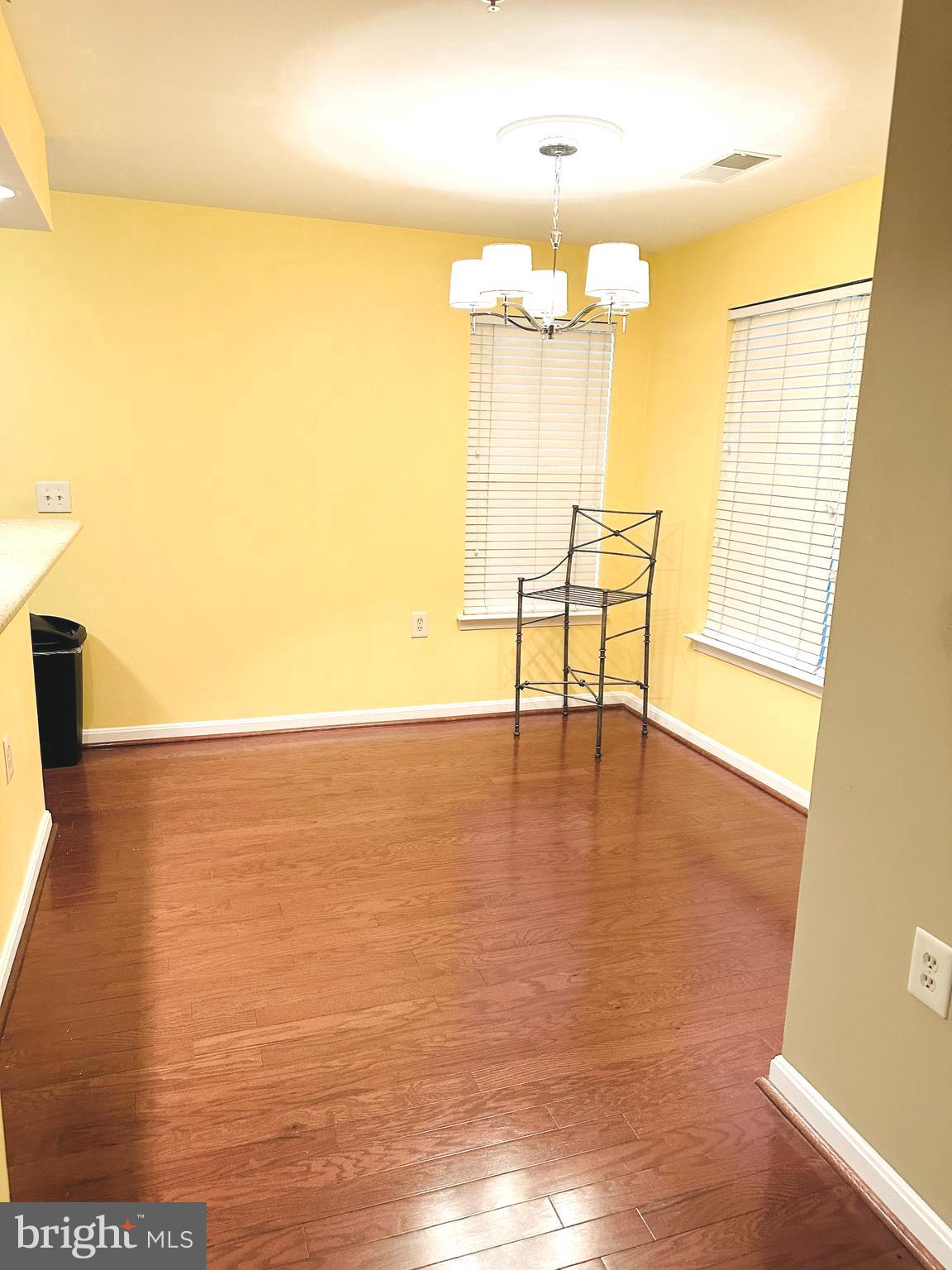 115 Timberbrook Lane, Unit 102 Gaithersburg, MD 20878 - Photo 5 of 20 a view of a room with a table and chairs
