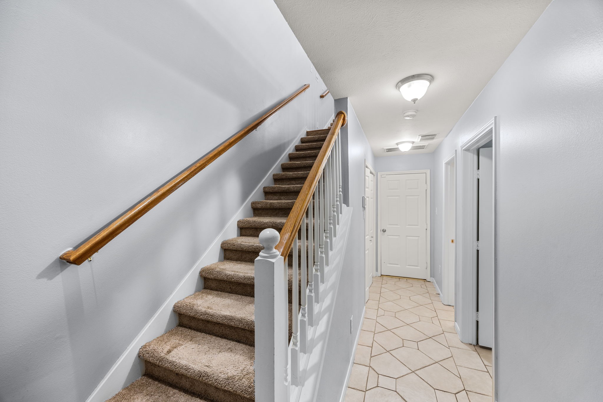 3023 Austin Street Houston, TX 77004 - Photo 5 of 26 1st floor features tile floors, 2-car garage, 1 bedroom with ensuite bath, laundry room