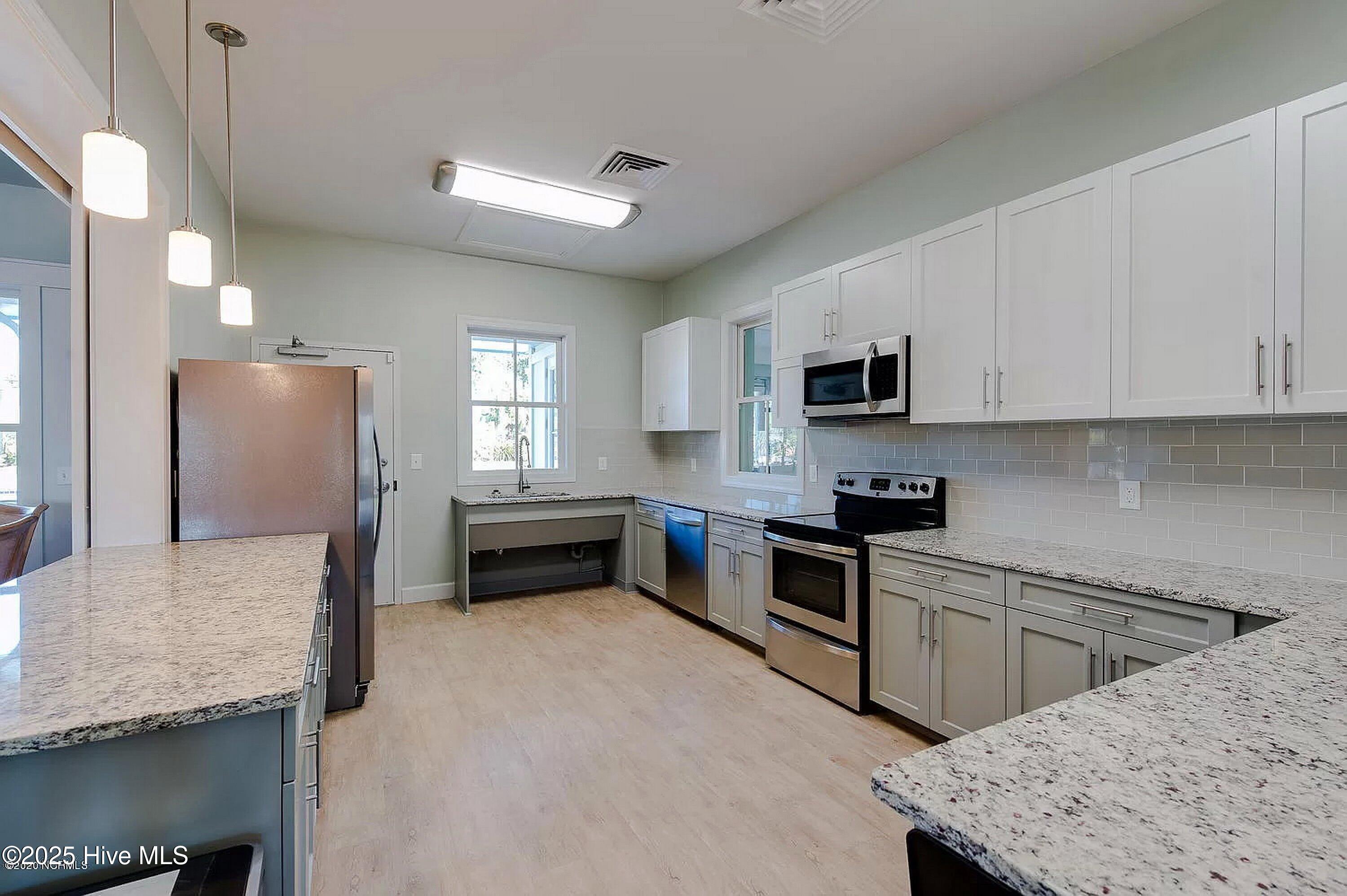 1226 Atrium Way Leland, NC 28451 - Photo 49 of 62 Clubhouse Kitchen