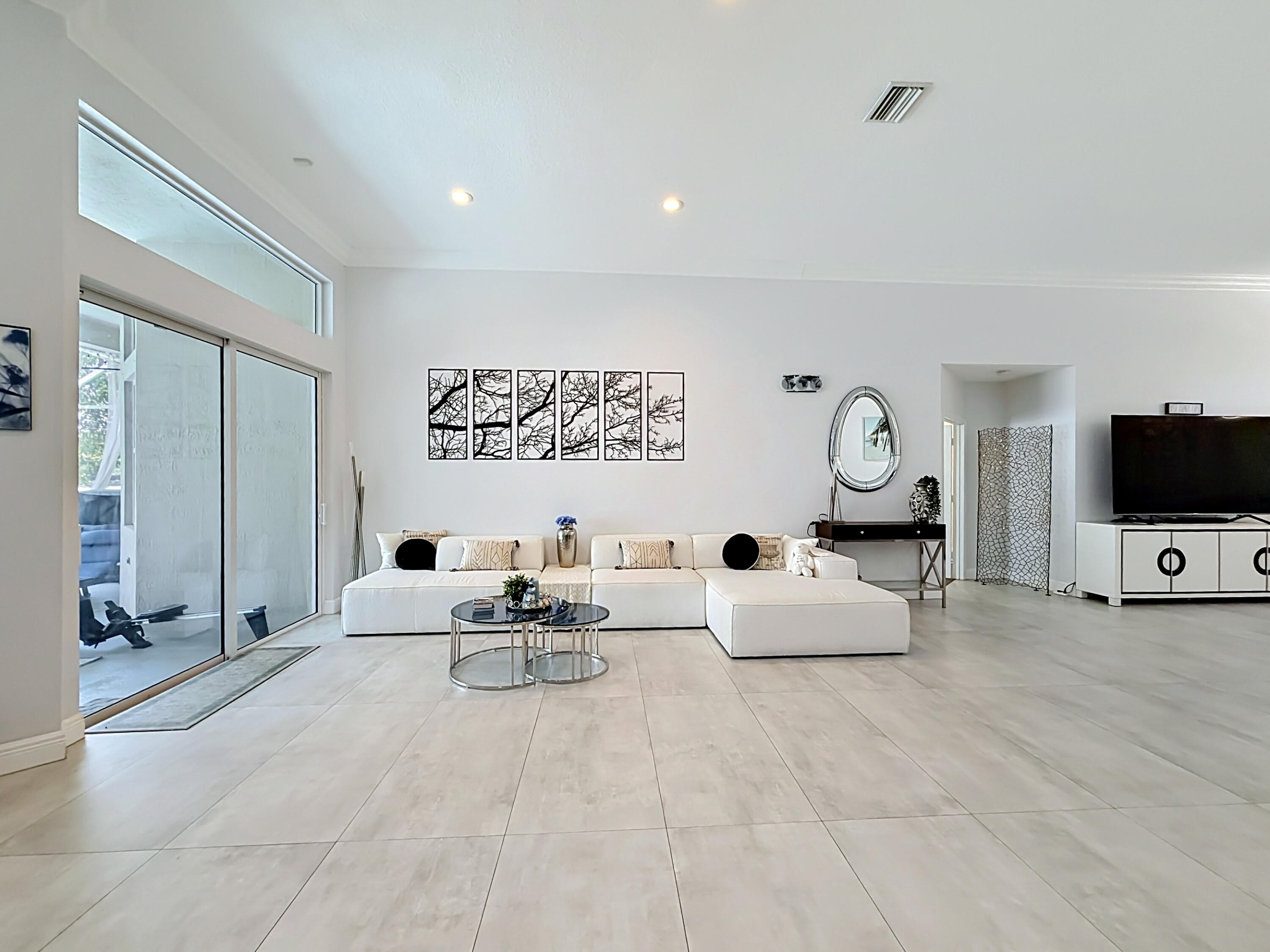 3836 Heron Ridge Lane Weston, FL 33331 - Photo 12 of 71 a living room with furniture and a flat screen tv
