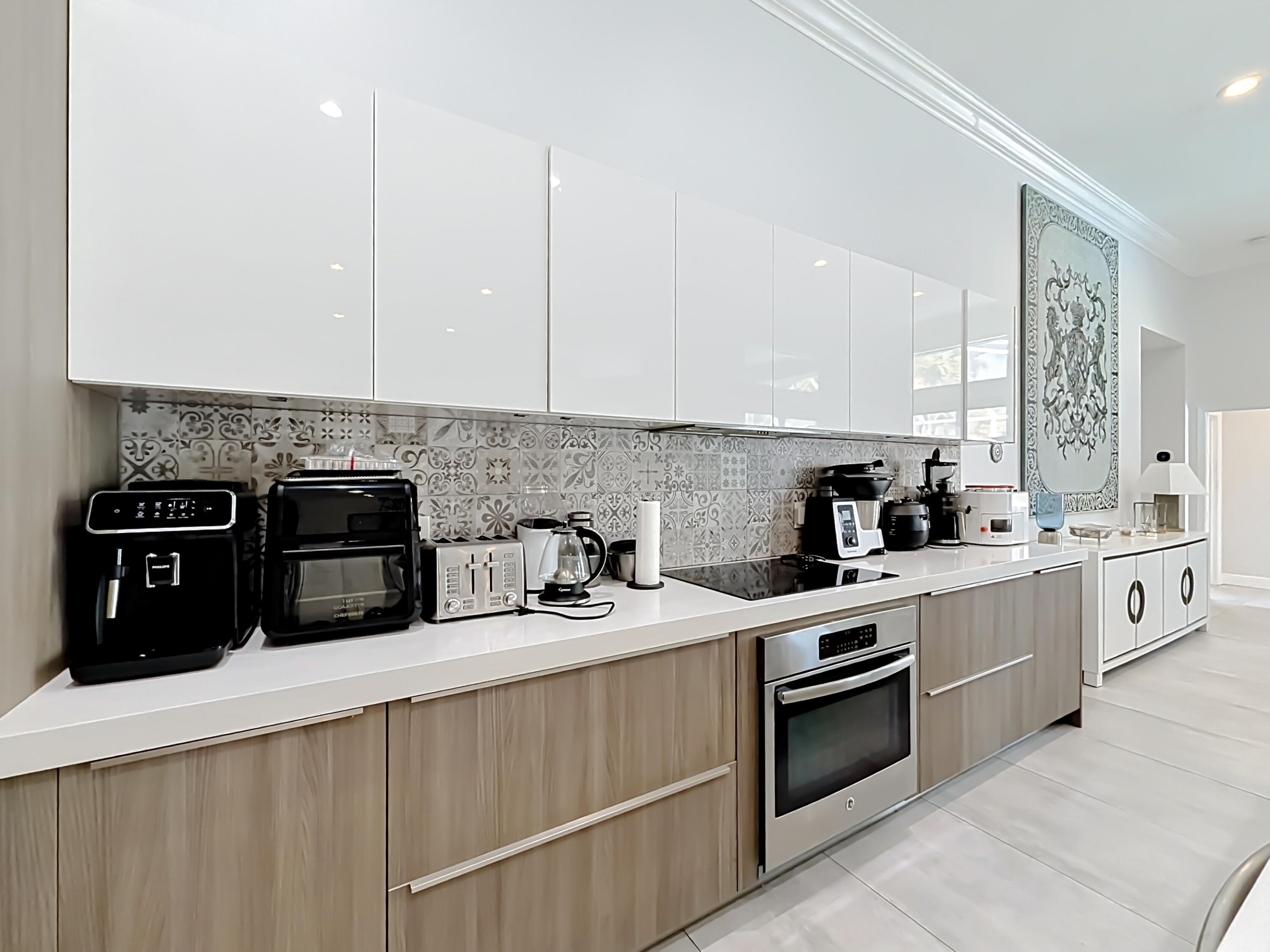 3836 Heron Ridge Lane Weston, FL 33331 - Photo 15 of 71 a kitchen with stainless steel appliances granite countertop a stove a sink and white cabinets