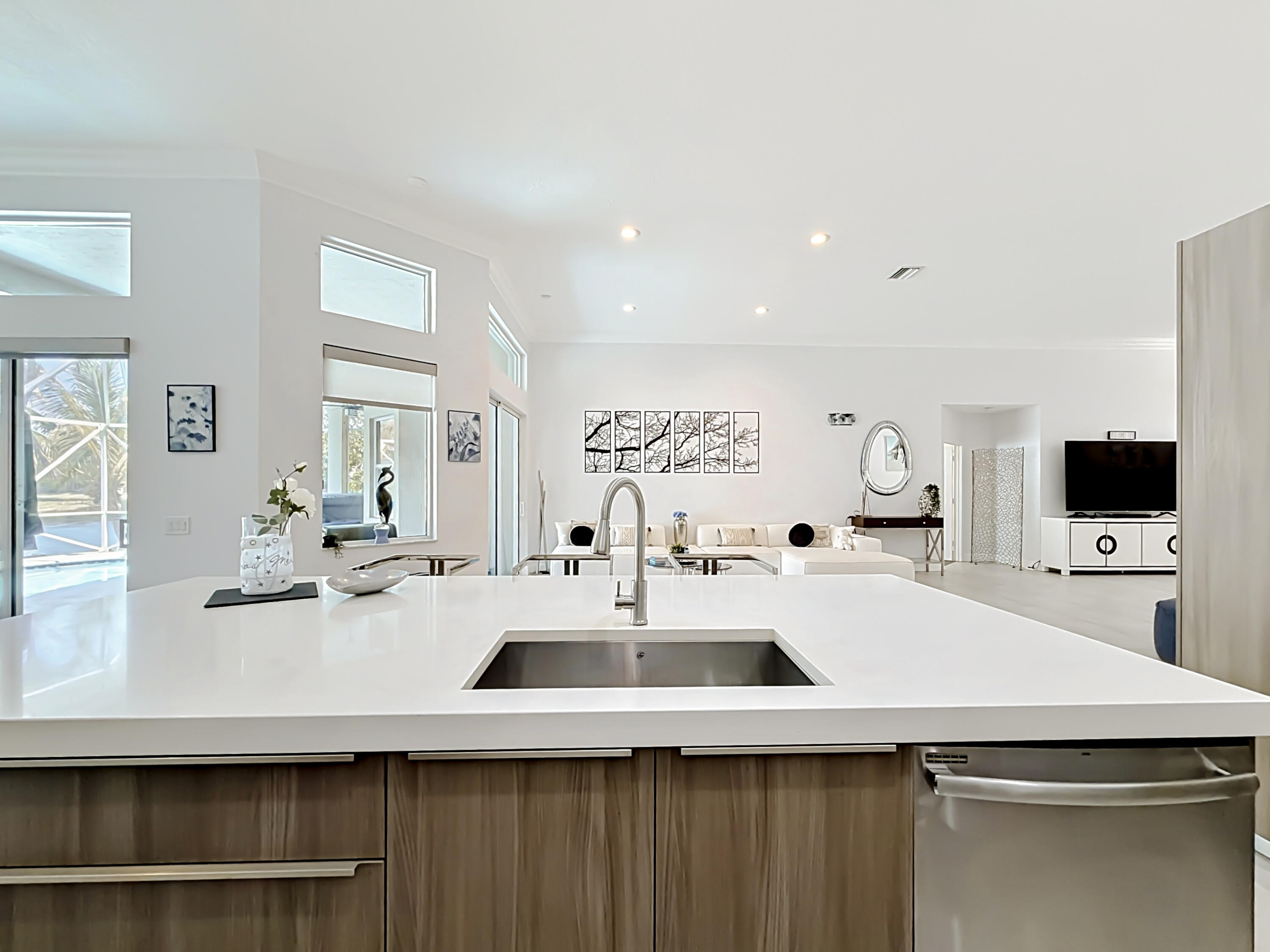 3836 Heron Ridge Lane Weston, FL 33331 - Photo 17 of 71 a kitchen with a sink a stove and chairs