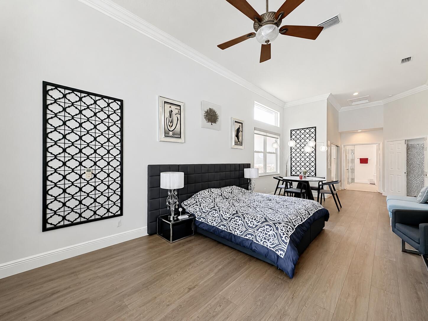 3836 Heron Ridge Lane Weston, FL 33331 - Photo 30 of 71 a bedroom with a bed chandelier and a window