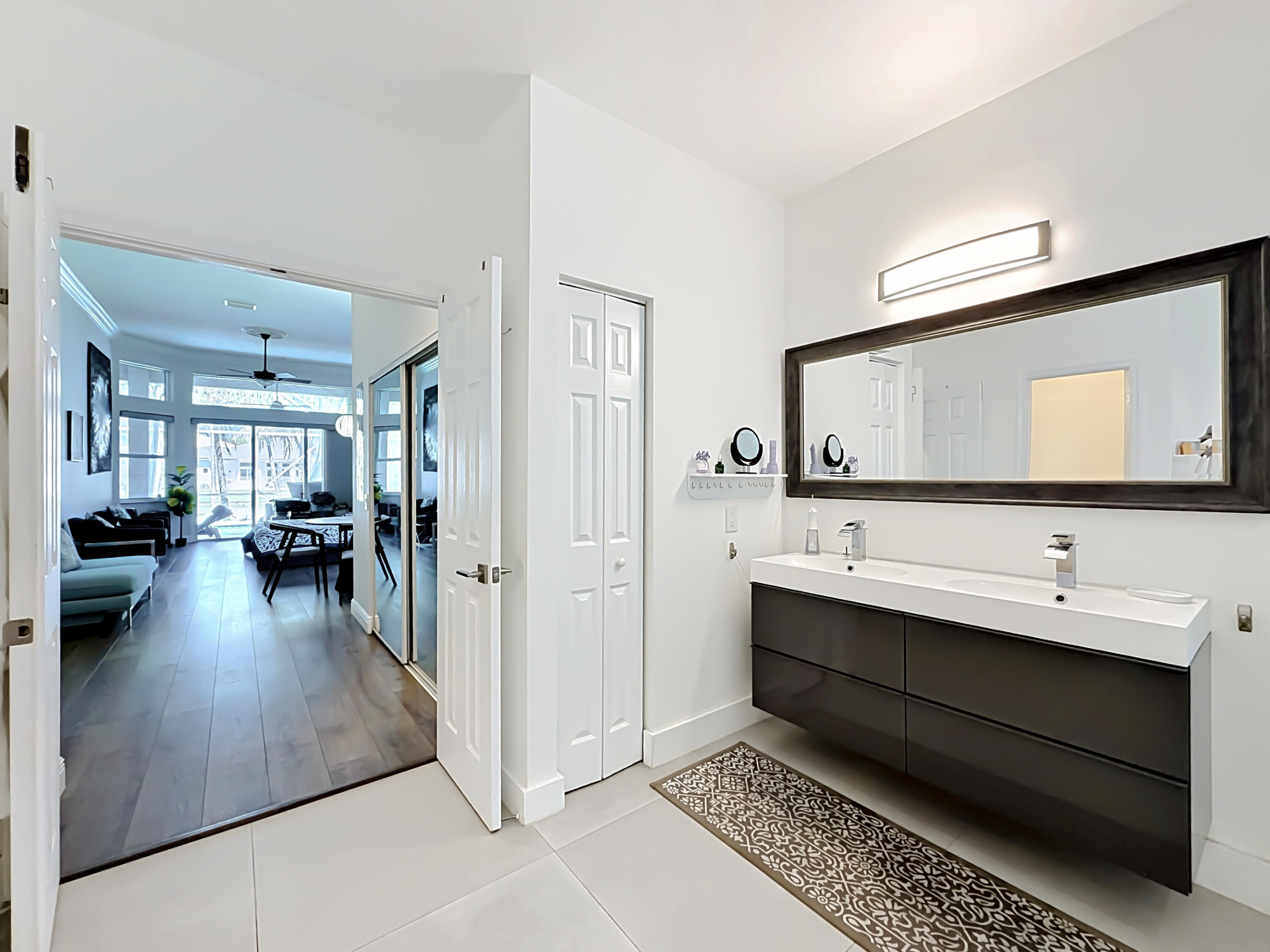 3836 Heron Ridge Lane Weston, FL 33331 - Photo 33 of 71 a en suite bathroom with a double vanity sink and a mirror