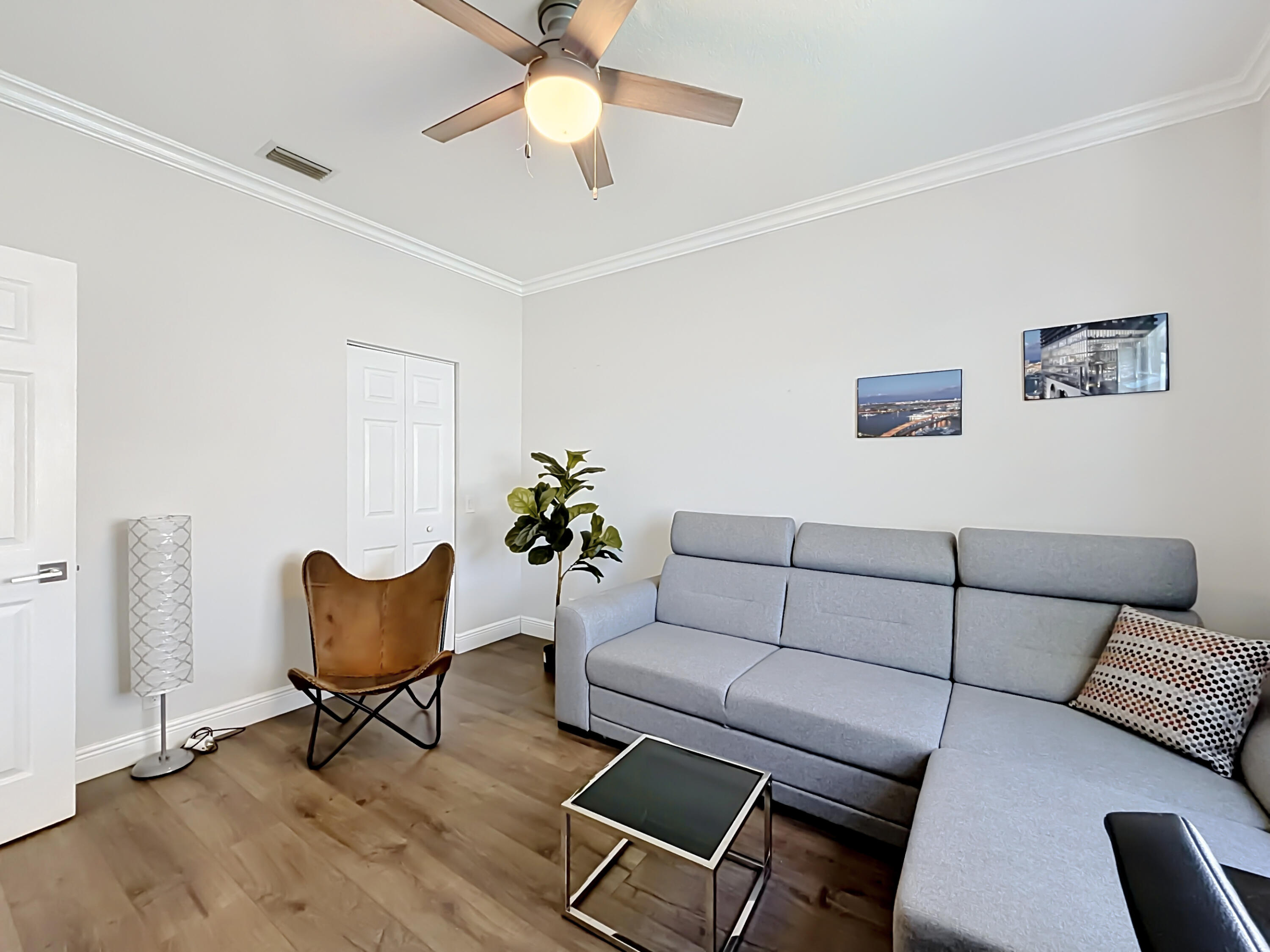 3836 Heron Ridge Lane Weston, FL 33331 - Photo 38 of 71 a living room with furniture and a wooden floor