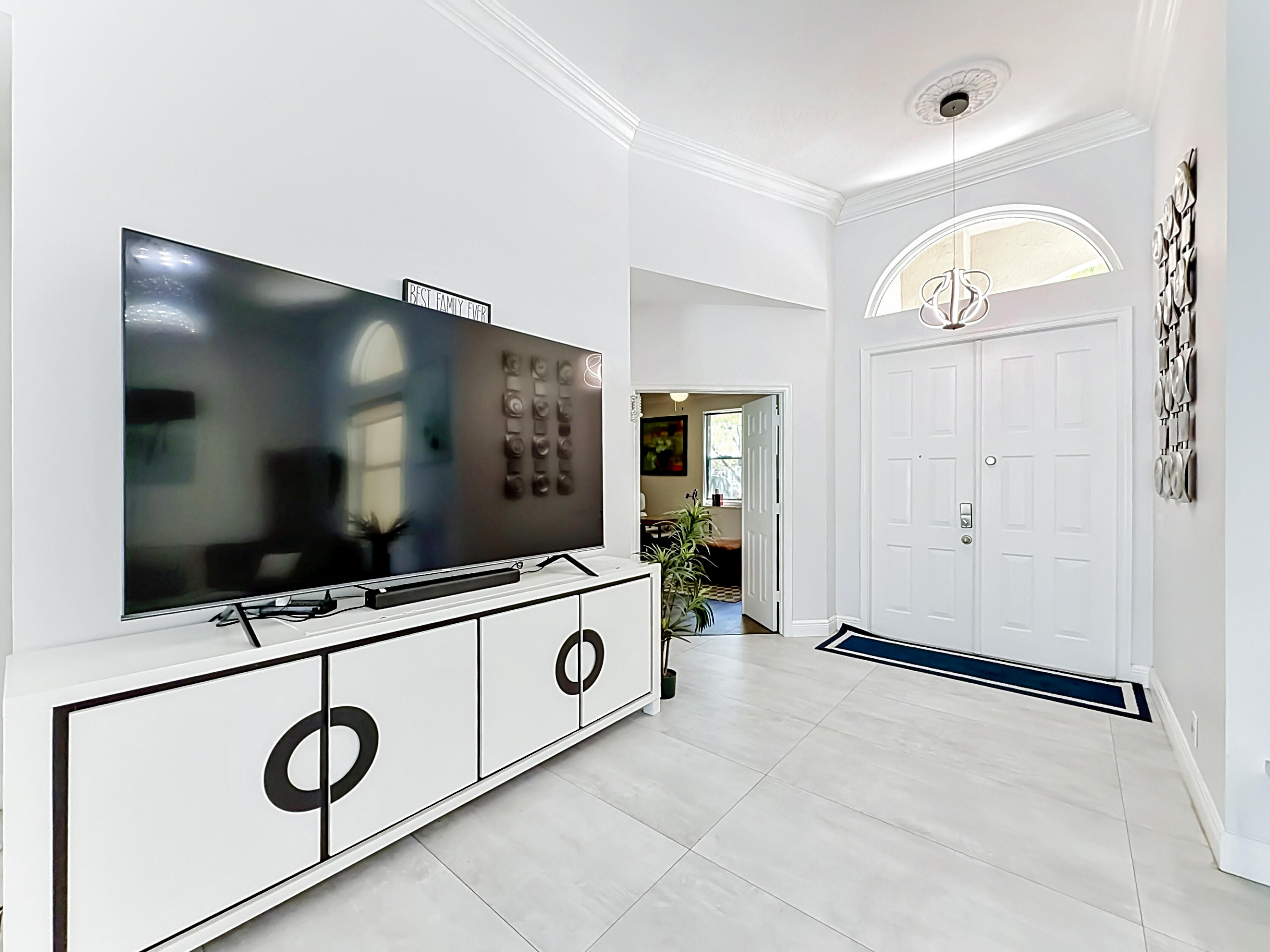 3836 Heron Ridge Lane Weston, FL 33331 - Photo 4 of 71 a living room with furniture and a flat screen tv