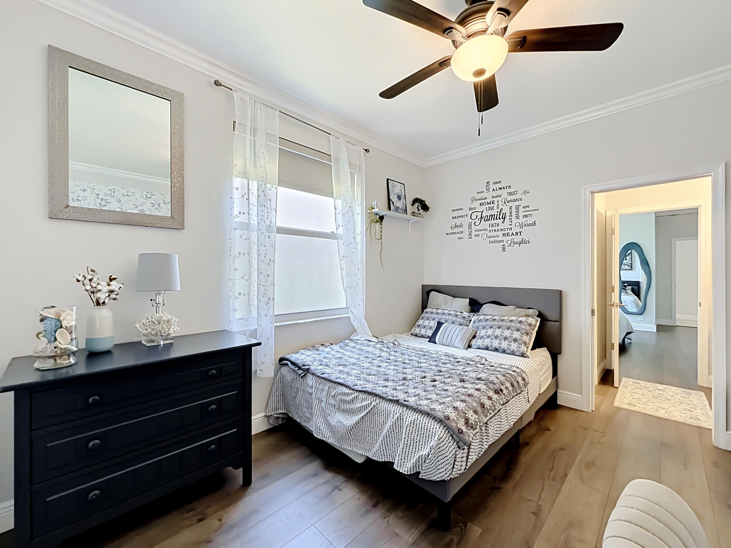 3836 Heron Ridge Lane Weston, FL 33331 - Photo 45 of 71 a bedroom with a bed and ceiling fan