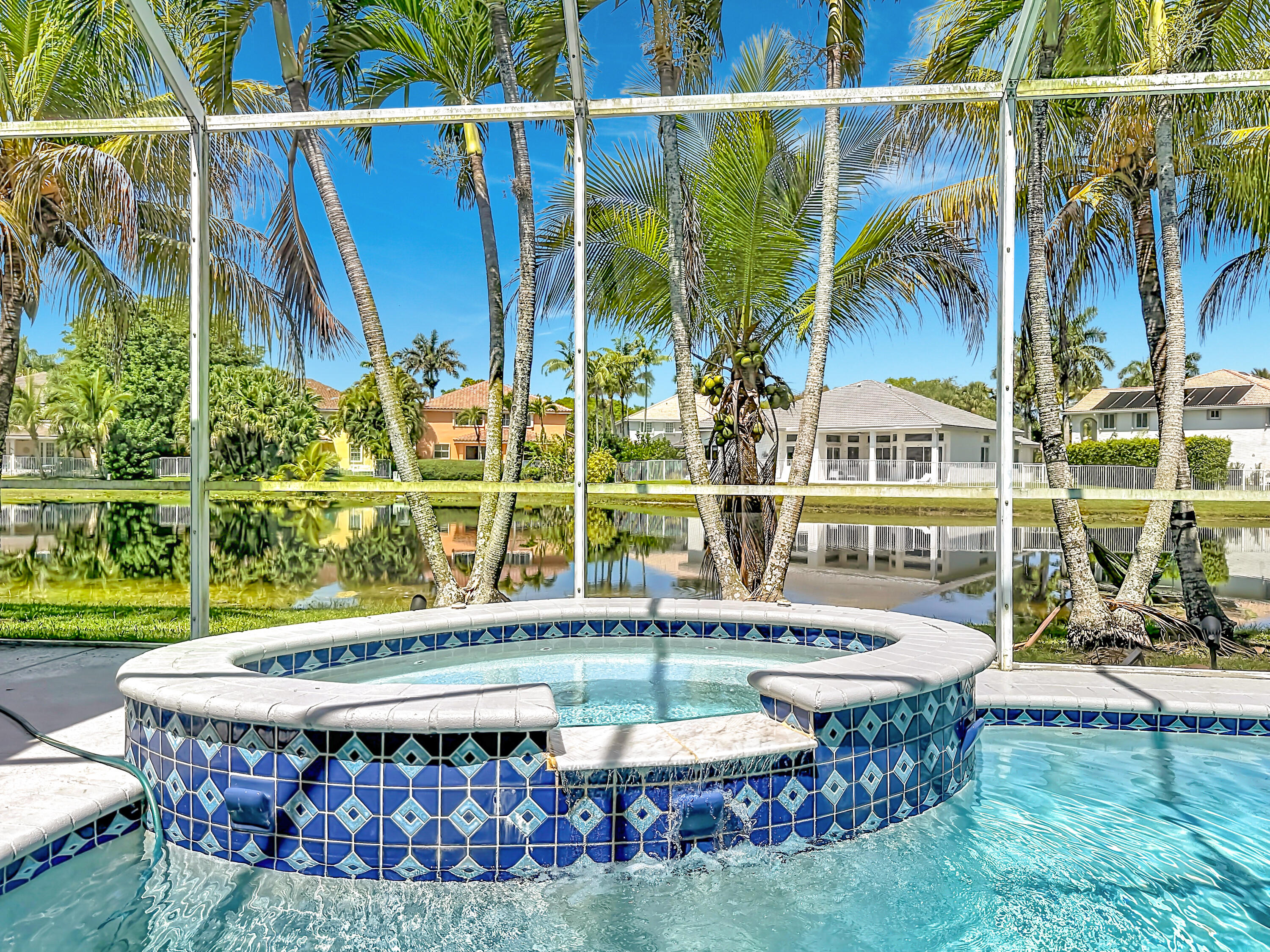 3836 Heron Ridge Lane Weston, FL 33331 - Photo 58 of 71 a view of a swimming pool with a patio