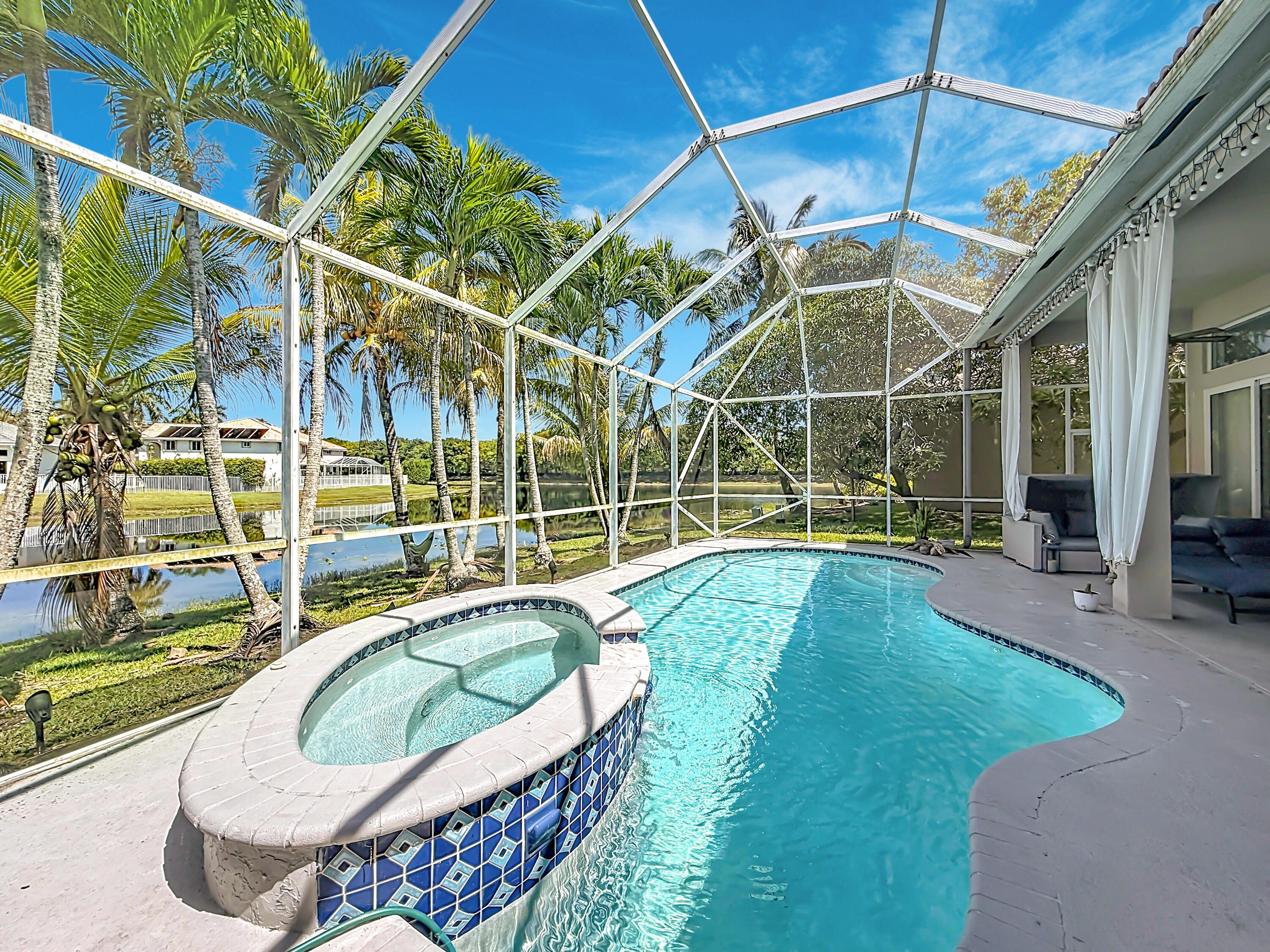 3836 Heron Ridge Lane Weston, FL 33331 - Photo 59 of 71 a view of a swimming pool with a patio