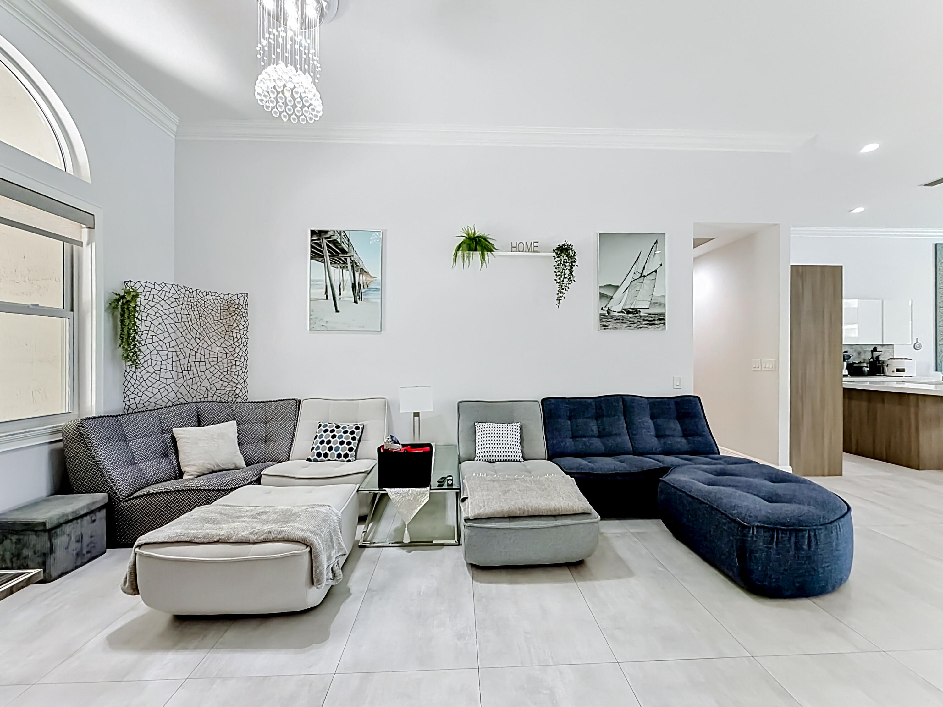 3836 Heron Ridge Lane Weston, FL 33331 - Photo 6 of 71 a living room with furniture and a chandelier