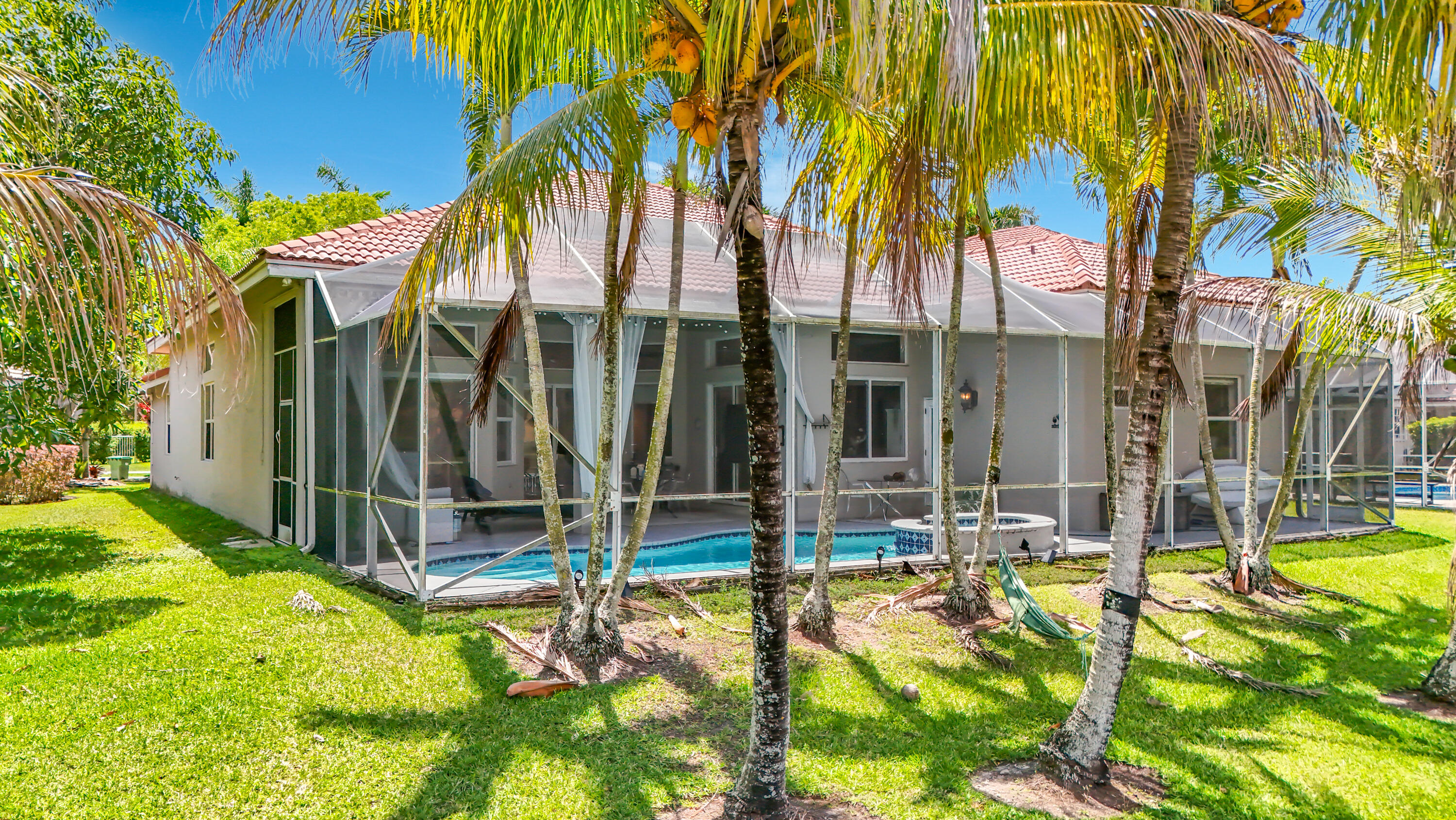 3836 Heron Ridge Lane Weston, FL 33331 - Photo 64 of 71 a view of a house with swimming pool and sitting area