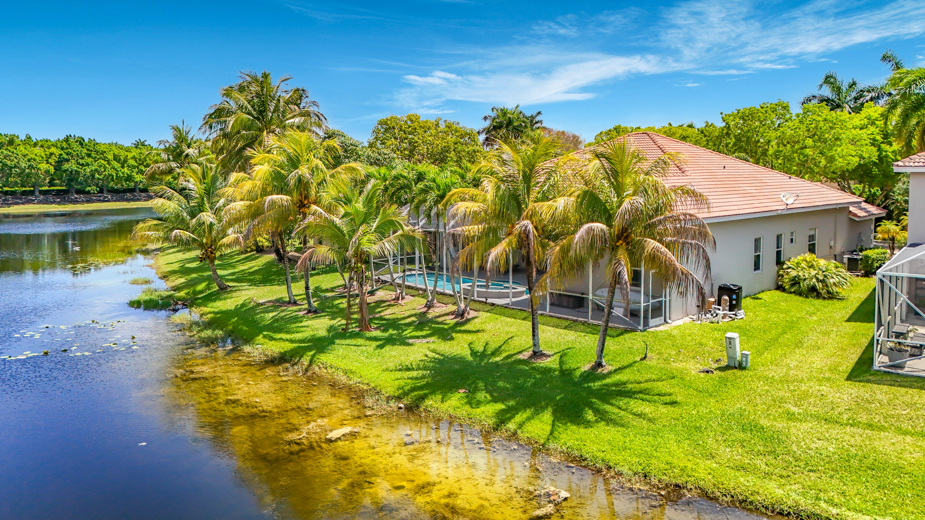 3836 Heron Ridge Lane Weston, FL 33331 - Photo 66 of 71 a view of a swimming pool with a yard