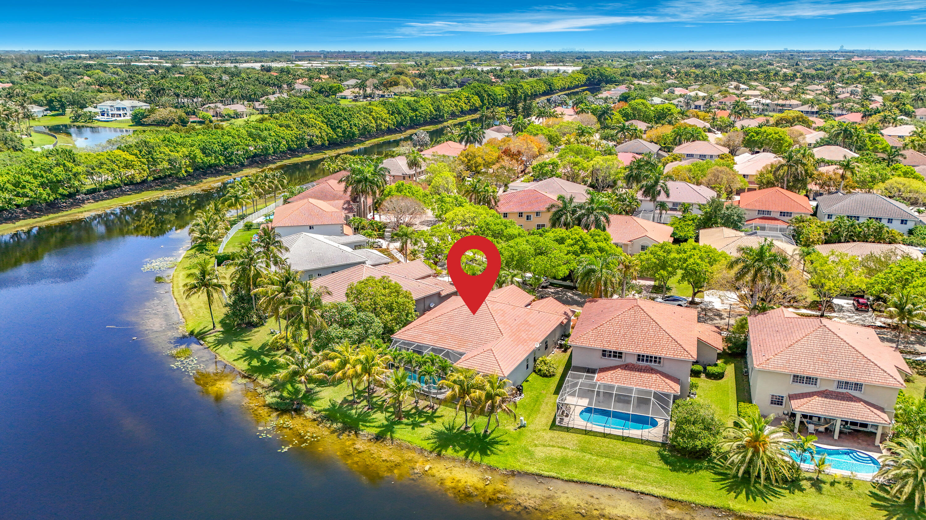 3836 Heron Ridge Lane Weston, FL 33331 - Photo 70 of 71 an aerial view of residential houses with outdoor space and lake view