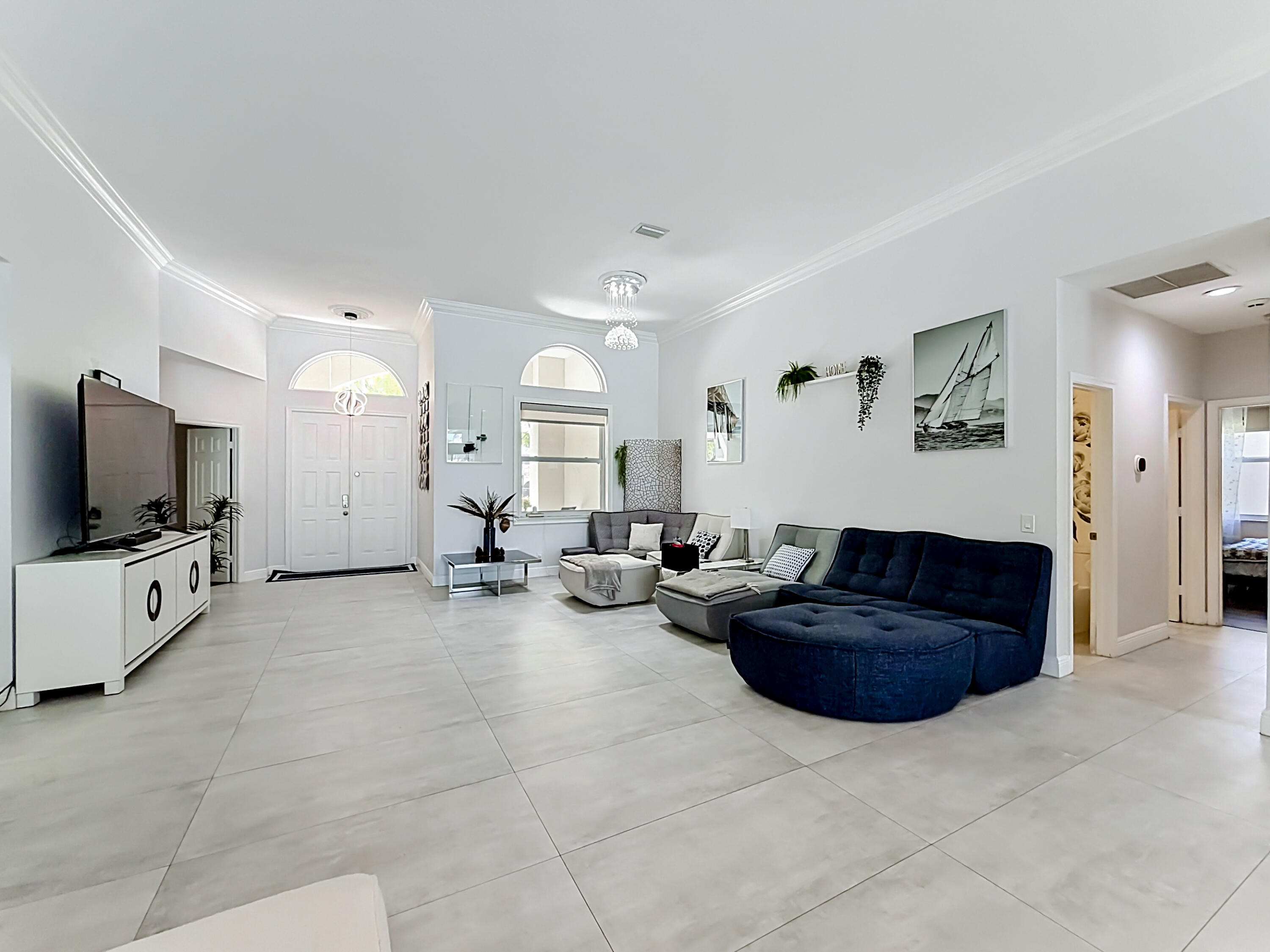 3836 Heron Ridge Lane Weston, FL 33331 - Photo 8 of 71 a living room with furniture and a flat screen tv